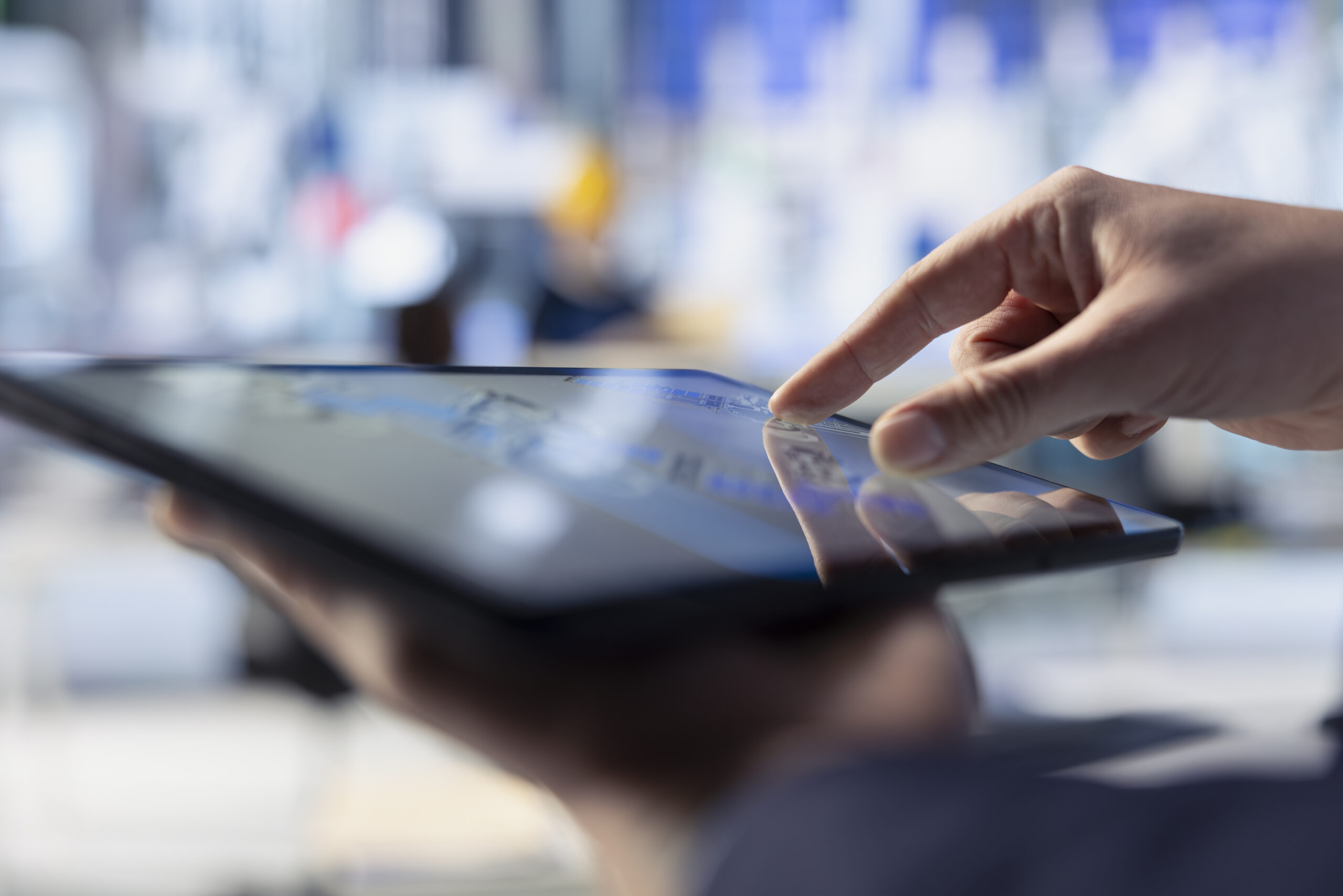 Photovoltaics factory worker uses tablet to inspect solar plant, close up